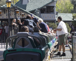 A Disneyland cast member working on the Matterhorn Bobsleds, keeps a watchful eye on park guests exiting their bobsleds after a ride down the mountain.