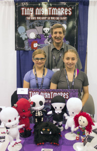 Steve Feicht, creator of "Tiny Nightmares," characters that kids encounter in their dreams, with his daughters Katie, 11, (left) and Devon, 15, (right).